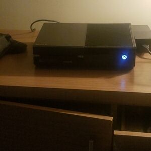 Microsoft Black Gaming Console with Blue Light